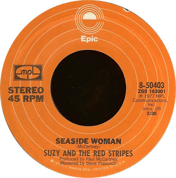 Suzy And The Red Stripes : Seaside Woman (7", Single)