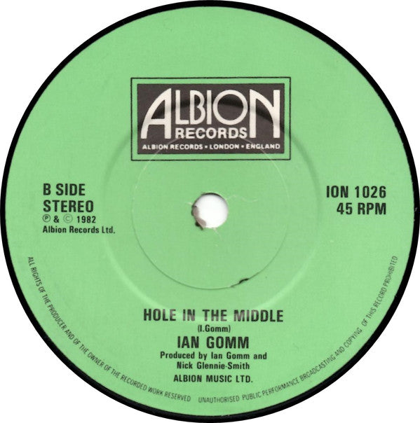 Ian Gomm : She'll Never Take The Place Of You / Hole In The Middle (7", Single)