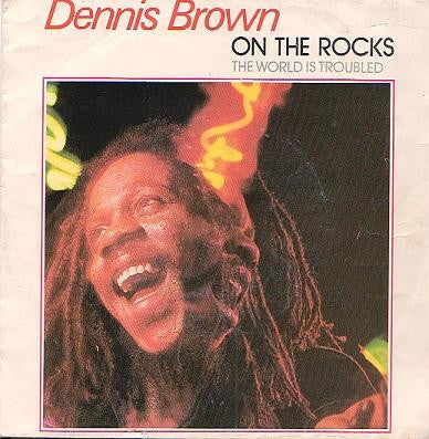 Dennis Brown : On The Rocks (7", Single)